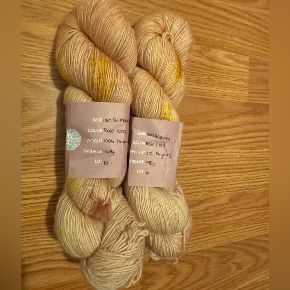2 skeins Wandering Flock fingering color Rose Gold.  NWT see description below